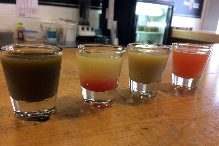 Another way to get a healthy boost of energy is in the form of Wellness Shots, available at Roots Pressed Juices. These shots are a series of small, concentrated juices that are consumed one after the other. In this series, dandelion, lemon with B12 vitamin added, and ginger are followed by a “chaser” of Bee Well juice.
