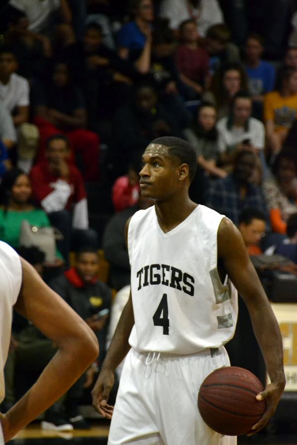 The Tigers boys basketball team played against the North Little Rock Charging Wildcats on Tuesday, Jan. 1. With both feet on the free throw line, senior Cameron Johnson eyes up the basket for his next two points. The wildcats went on to beat Central 92-91.
