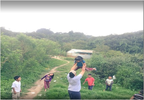 Junior Oliver Burrow doesn't let the language barrier keep him from playing with children from a nearby Guatemalan village. 