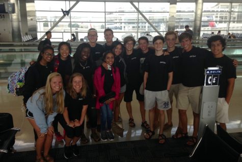 American students smile in the Detroit Airport before heading to South Korea.