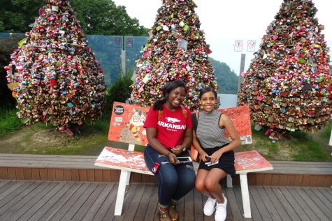 Jada Brunson- a Central alumn- and senior Jada Henry sit in front of the Locks of Love at the base of Seoul Tower.