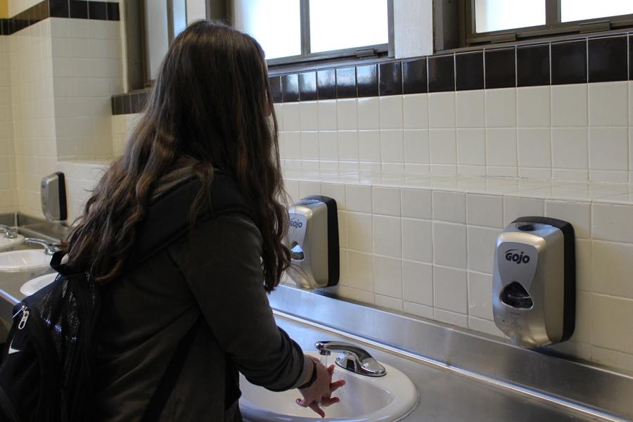 In the newly renovated second floor girl’s bathroom, sophomore Hayden Wickliffe washes her hands using the automatic soap dispensers in between classes. The soap dispensers were included in the bathroom improvements that occurred during summer of 2016.