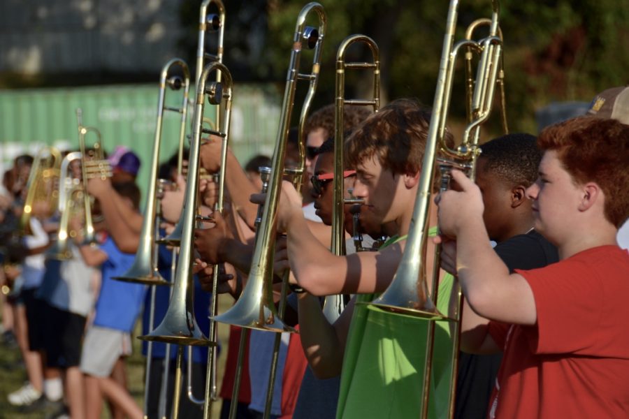 Members of marching band practice their line-up at Quigley.