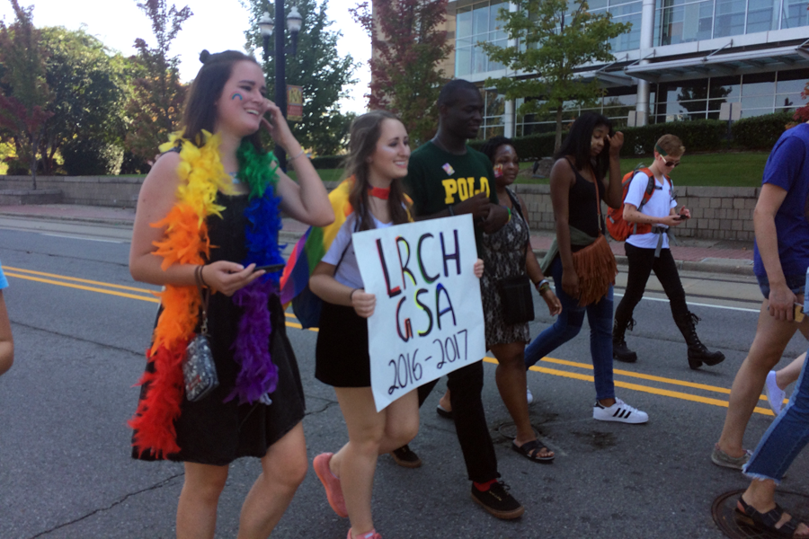 (From left) Andrea Peterka, Mary Caroline Peek, Monte Toney, Miriam Ashford, Cailen Cobbs, and Lawliet Ryker participate in the Gay Pride parade on October 16 at the Clinton Presidential Center to show off their support for the LGBT community. 