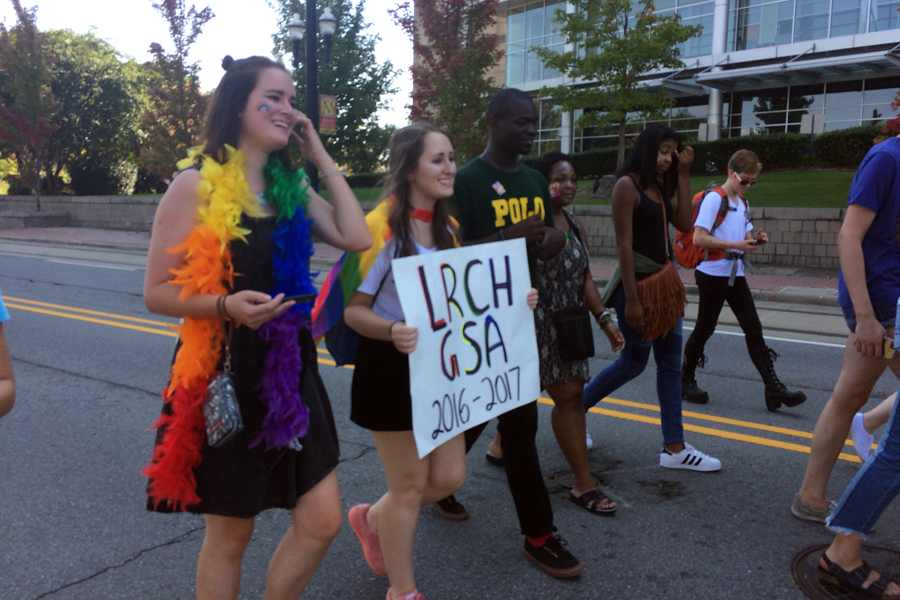 (From left) Andrea Peterka, Mary Caroline Peek, Monte Toney, Miriam Ashford, Cailen Cobbs, and Lawliet Ryker participate in the Gay Pride parade on October 16 at the Clinton Presidential Center to show off their support for the LGBT community.