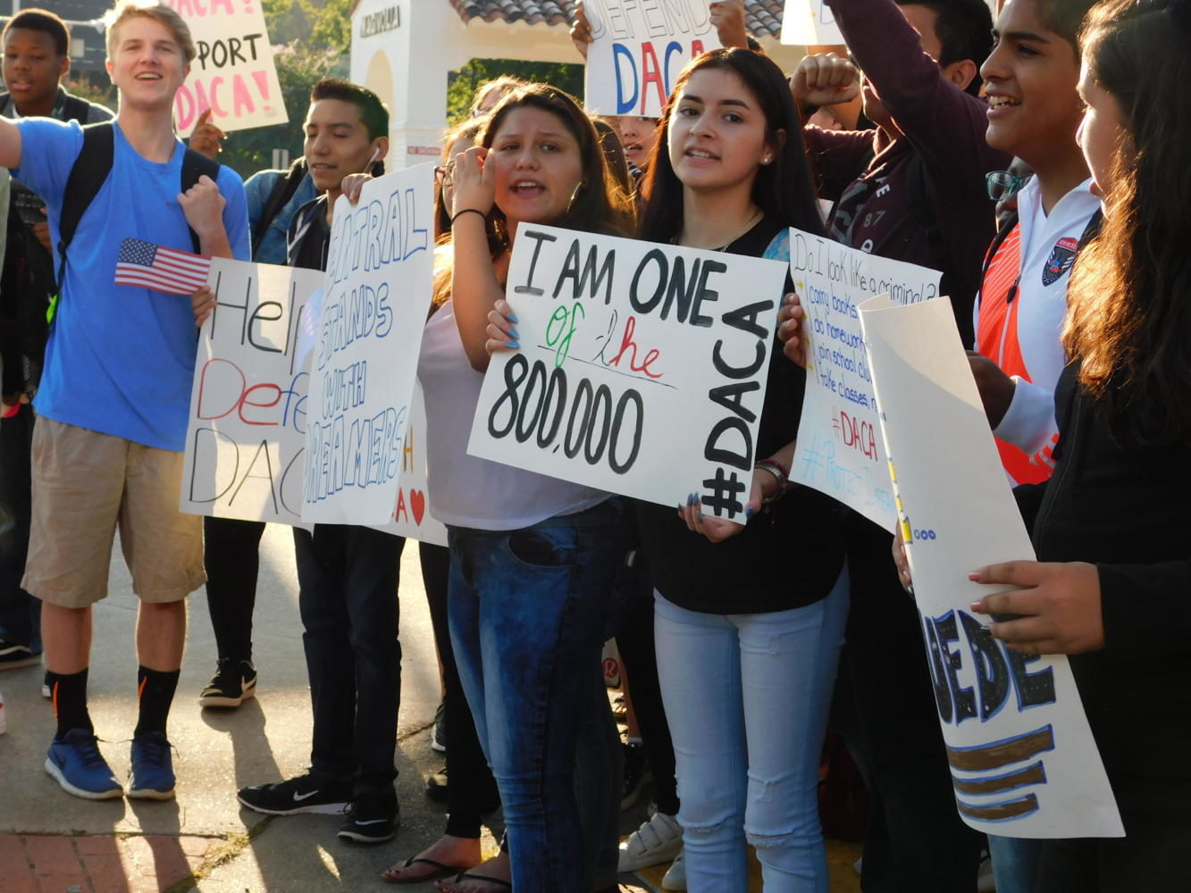 Students stand proud with their signs to protest the President's decision to dismantle DACA, a program that helps hundreds of thousands of undocumented children. 