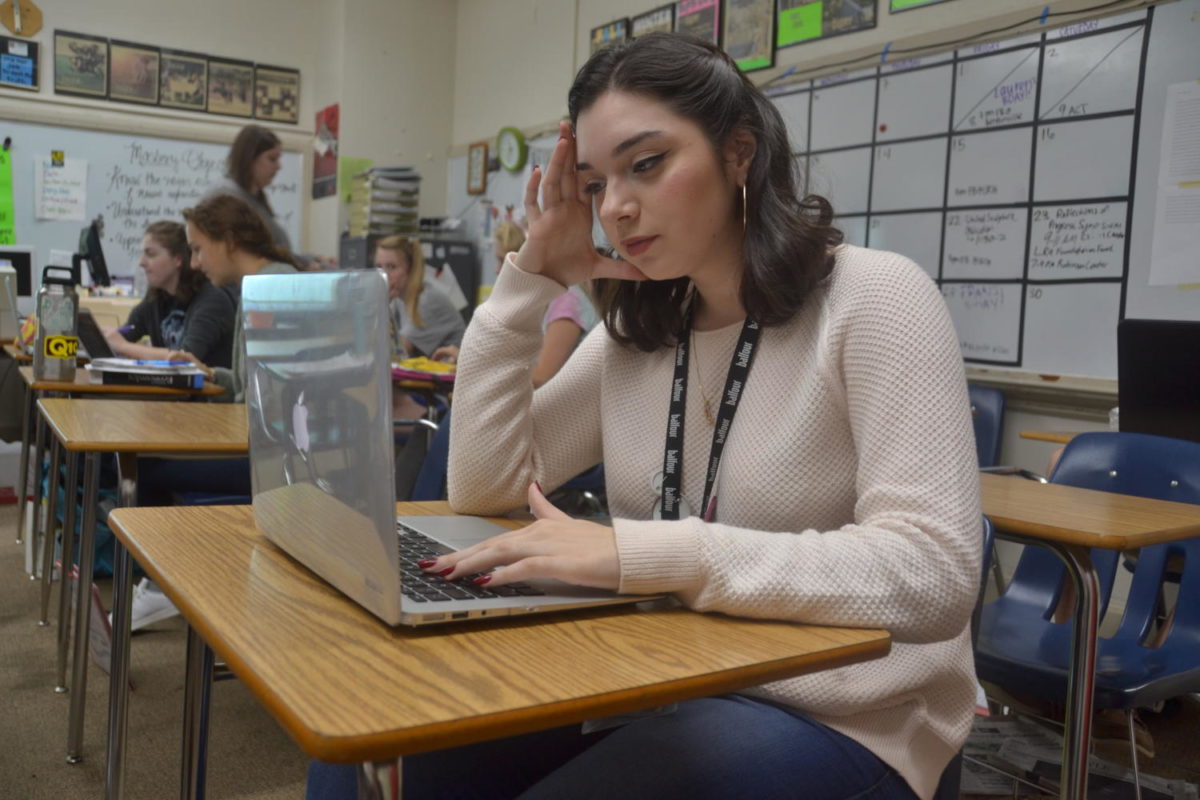 Senior Alexis Leyva stresses over her computer about her college application. (Photo by Rebekah Harpool)
