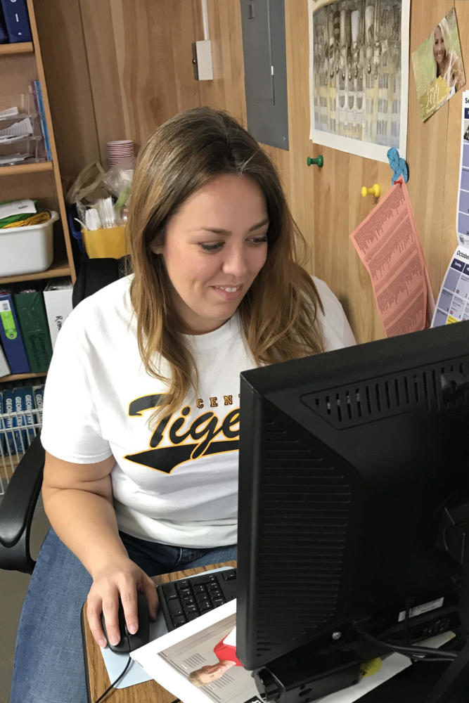 Pre-Calculus and Quantitave Literacy teacher Melissa Riley sits at her desk editing her team as she prepares for this Sunday’s games.