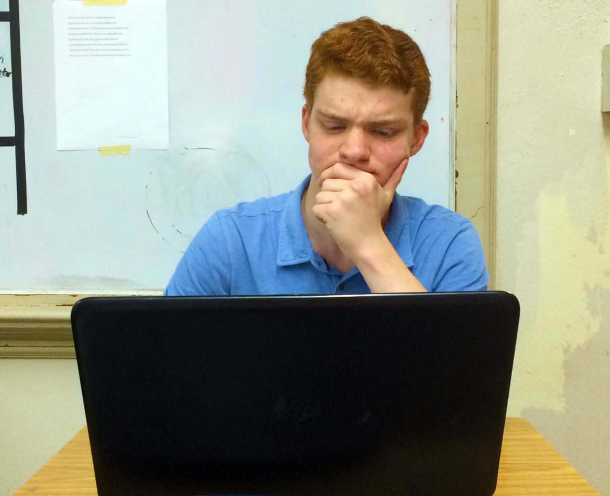 Senior Sam Pierce struggles with logging into his eSchool account. Many students have encountered an error message as they attempt to check their grades with the new program (photo by Jessie Bates).