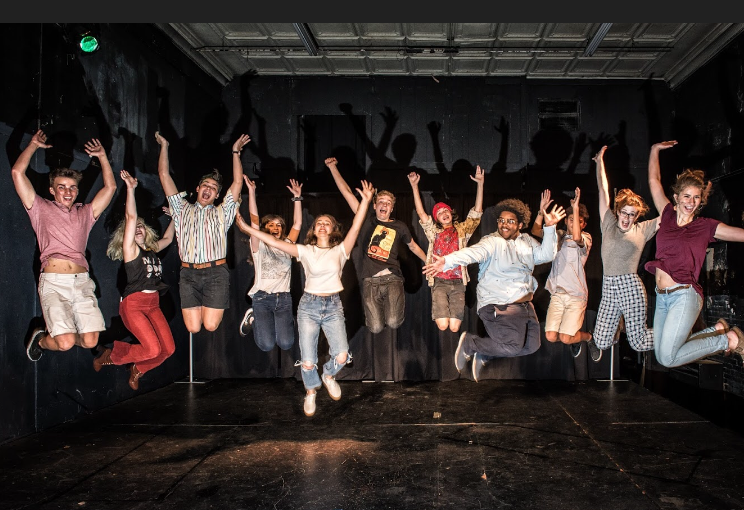 The Armadillo Rodeo cast jumps for joy at their new season, which begins with their first show on October 27. They will be performing at the Public Theatre downtown on 616 Center St. (Photo courtesy of Ollie Burrow)