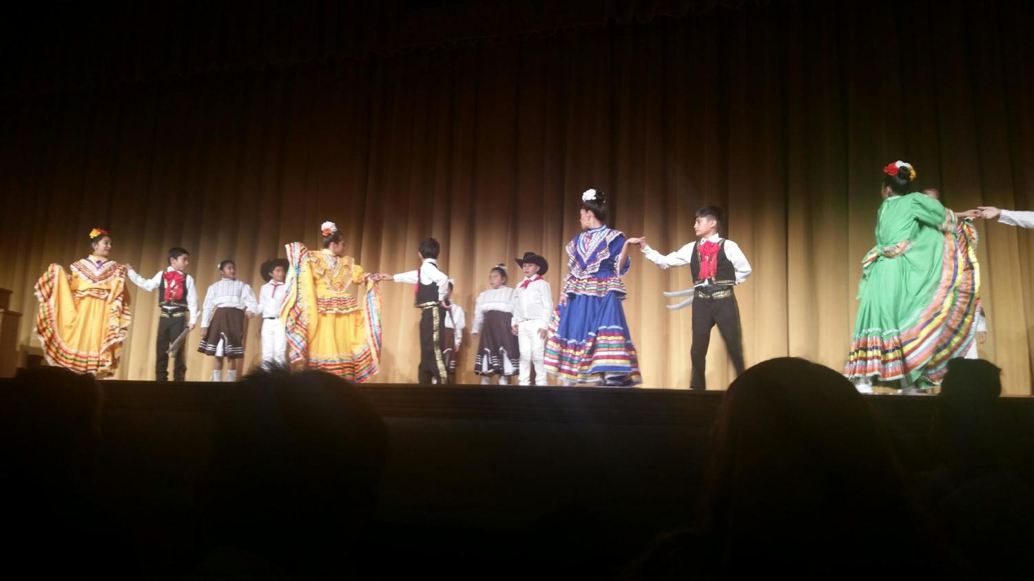 The Latin dance club dances for the 80 Bites Around the World performance after the food, which was brought from the many different cultural clubs, was served (Photo courtesy of Michelle Chiu).