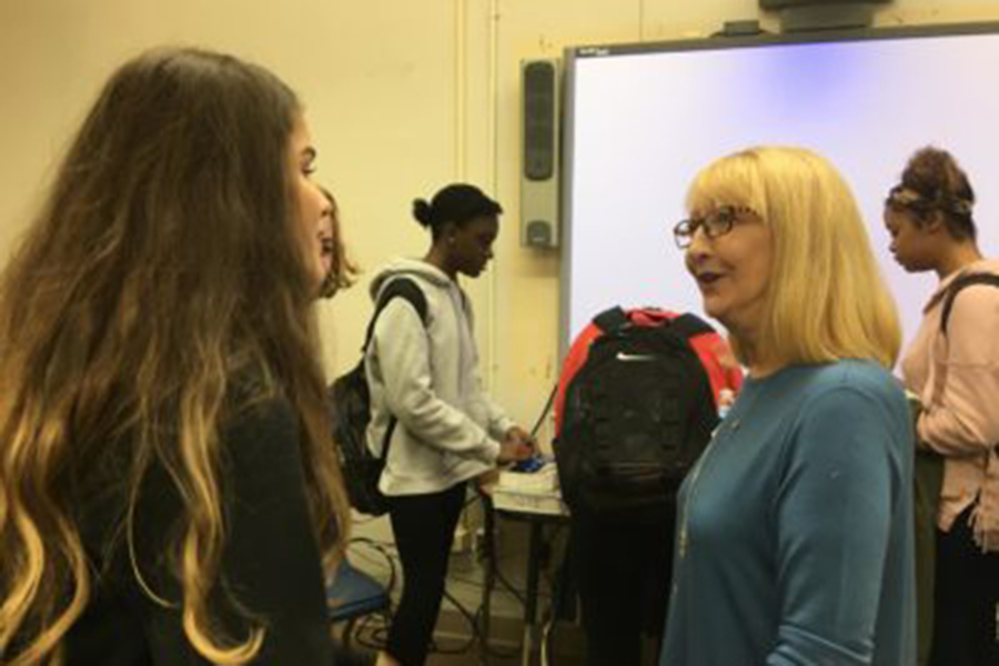 Freshman Riley Cunningham speaks with Susan Inman about volunteering as other Young Democrats sign up to work with Inman’s campaign. (Photo by Jacob Major)