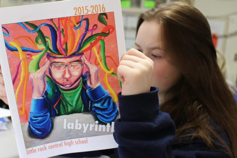 Senior Julia Greer reads an older edition of the Labyrinth as she eagerly awaits the release of the 2017-2018 edition. (Photo by Fran Delacey)