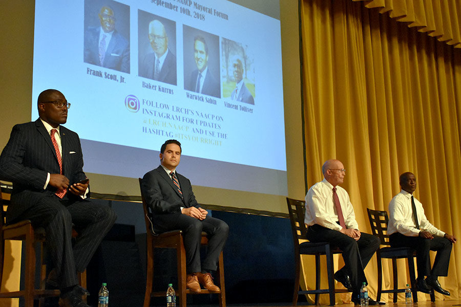 The four mayoral candidates (from left) Frank Scott Jr., Warwick Sabin, Baker Kurrus, and Vincent Tolliver share their platform ideas in the mayoral forum for the NAACP. (photo by Claire Hiegel)