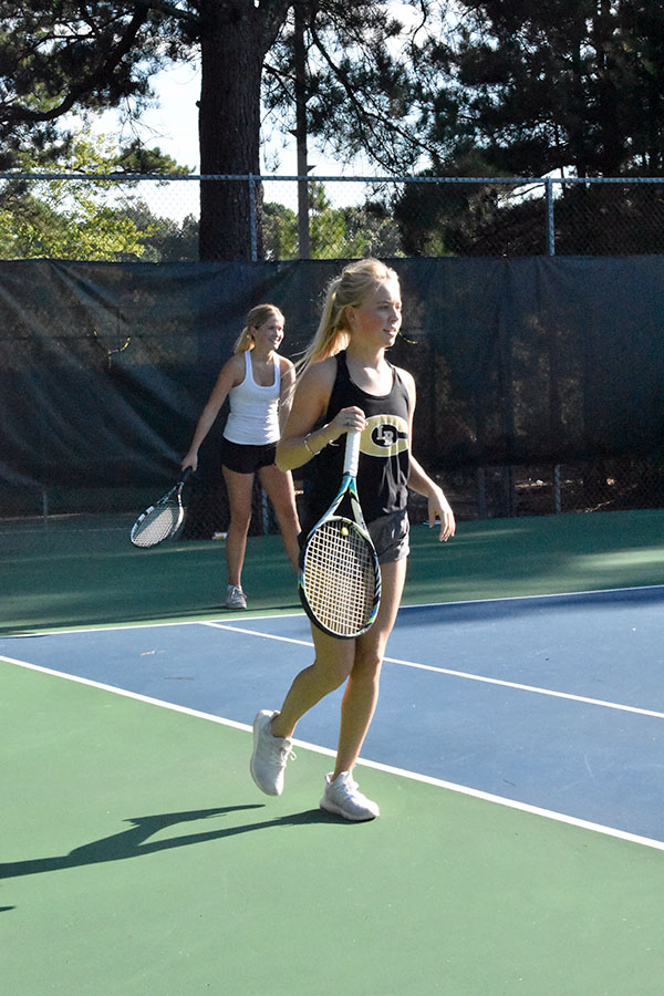 Seniors Mary Kathryn Roberts and Abby Adkins compete in a doubles match against Mount St. Mary’s Tuesday Aug. 25 at Rebsman Park. (photo by Parker Gunn)