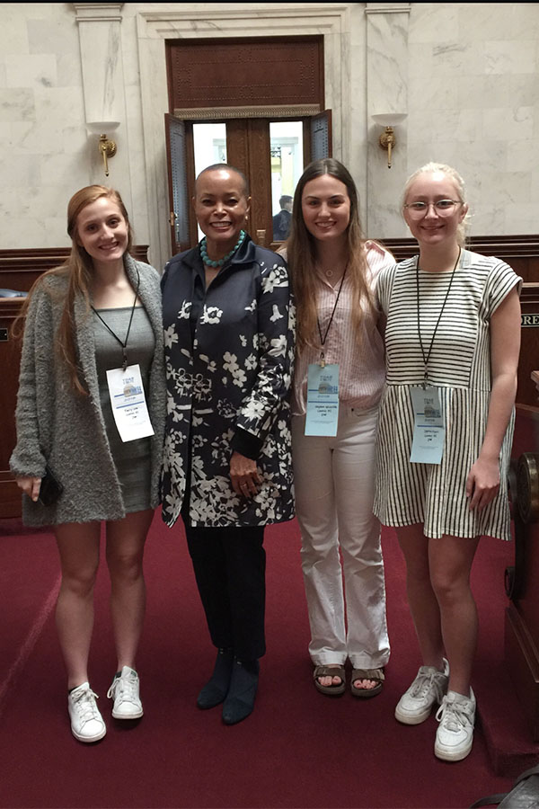 (From Left) Senior President Emily Low, Senator Joyce Elliott, Senior President Hayden Wickliffe, and Sophie Ryall meet at the Young Democrats Conference to hear local and state politicians speak at the State Capital. (photo by Emily Low)