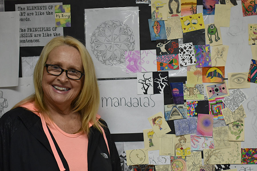 Intro to Art teacher Karen Terry displays her students’ artwork in the classroom. (photo by Claire Hiegel)