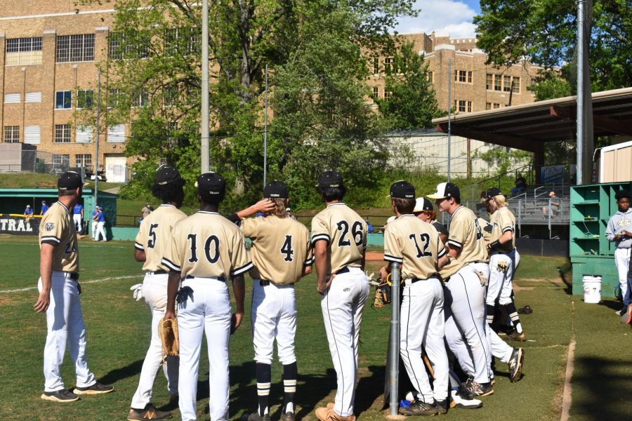 The Tigers huddle around in anticipation as they wait to take the field before the game.  Photo by Lillie Dunagan