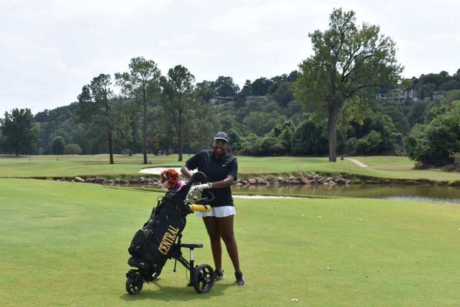Kayln Pendelton puts her club away and gets ready to head to the next hole at the Rebsamen. Pendelton won first place overall at the Jaycees Golf tournament on Aug. 30. 
