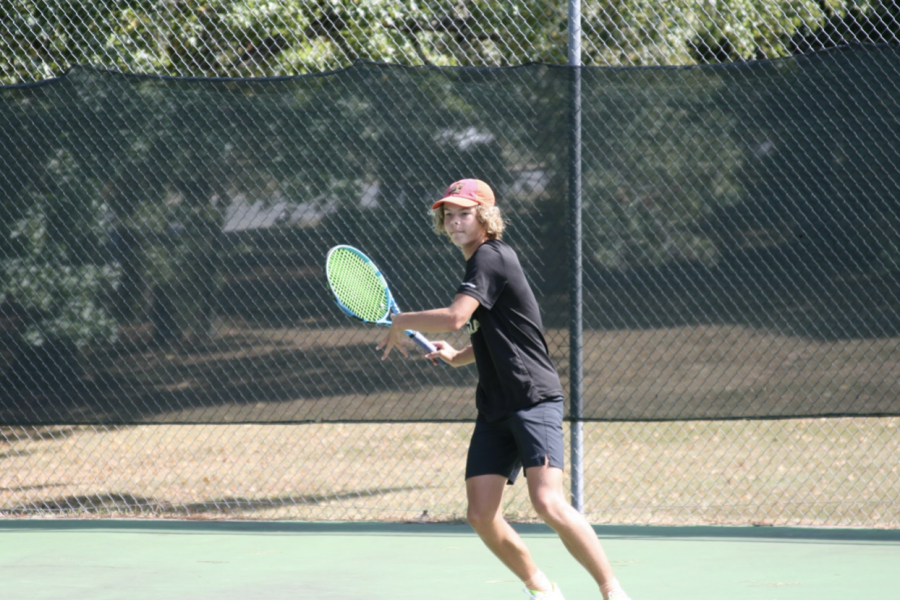 Freshman+Caden+Highfill+prepares+to+hit+the+ball+back+to+his+opponent+from+Bryant+High+School+at+Rebsamen+Tennis+Centre.