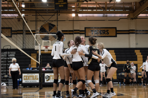 The varsity volleyball team celebrates winning a point against Maumelle at home Aug. 25. 