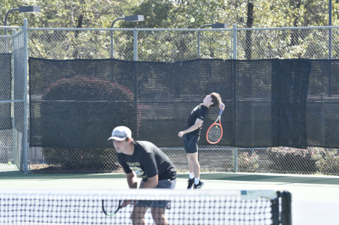 Senior Alex Wells serves in the team’s victory against Jonesboro in the Overall State Competition at Burns Park on October 19th. Wells has played tennis since he was nine years old, eventually rising to become the top ranked tennis player in Arkansas from ages 15 to 17. Photo by Thomas Hout
