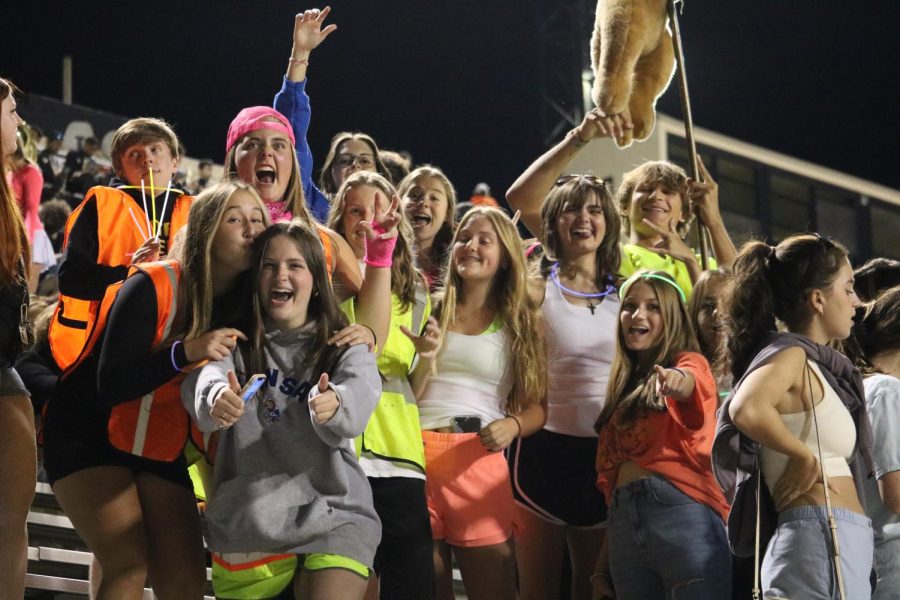 The student section dresses out in neon for the varsity football game against Fort Smith Northside Sept. 30.