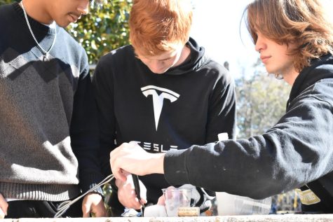 Students Hunter Johnson, Wilson Kanaday, and Andrea Castelli prepare to launch dry ice rockets in Tommye Butchers physics and engineering class Nov. 11. 