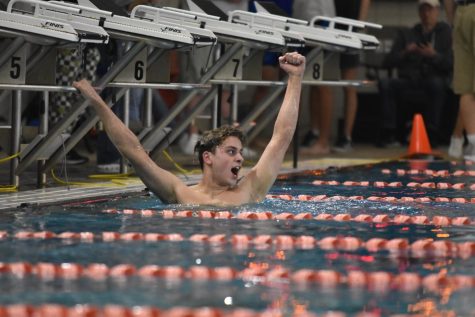 Freshman Joshua Smith celebrates after winning the Boys’ 500 yard freestyle and breaking the five minute barrier in the event for the first time. “I had been working towards this for about a year now, so I was ecstatic to see all my hard work pay off.”
