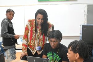 Ganelle McBryde works with student DaJaylin Holmes in Theatre 1 class 
