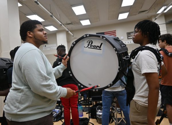 Mario Humphries, assistant band director, coaches the drumline during his A2 band practice.