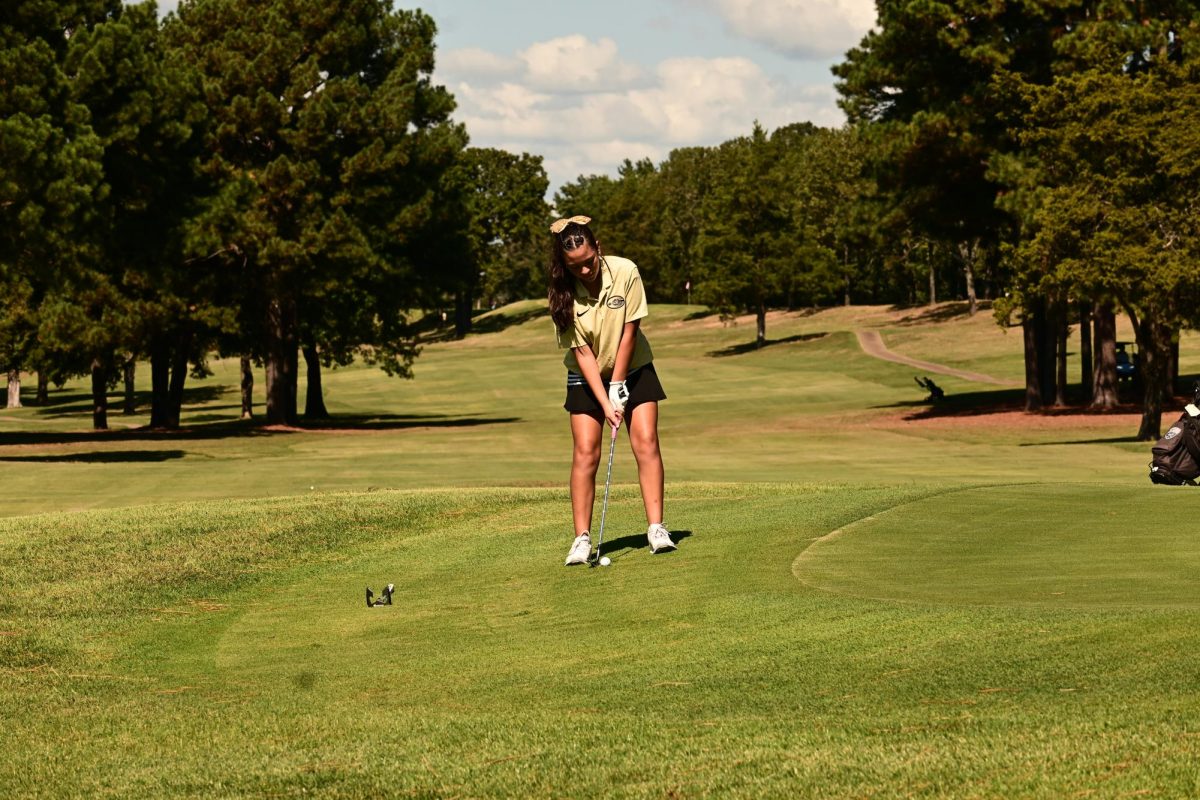 Tali Yanez putts on the first day of the Golf State Tournament in Conway. Yanez's performance helped the girls reach the second day of play. Photo by Elizabeth Rigsby 