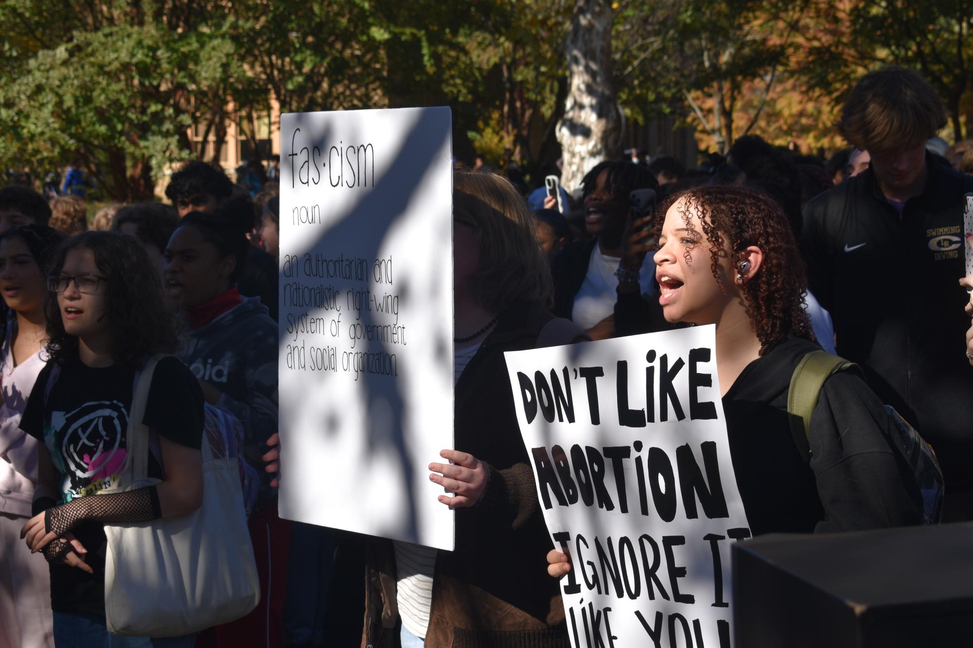 Sophomore Chloe Bradford protests on abortion rights at the walkout. 