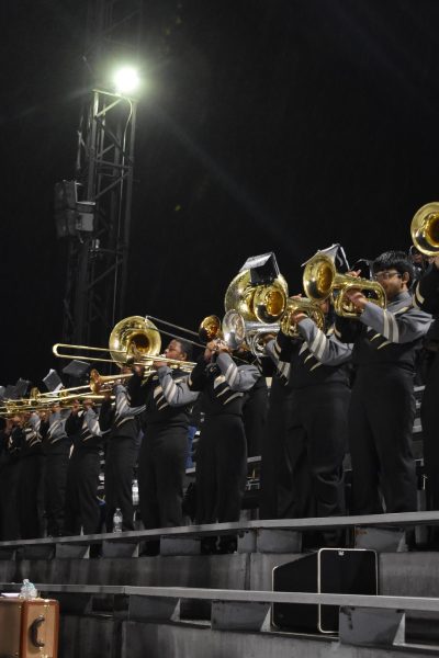 The band brass section plays before the rain starts during the final home game, Nov. 8, against Southwest.