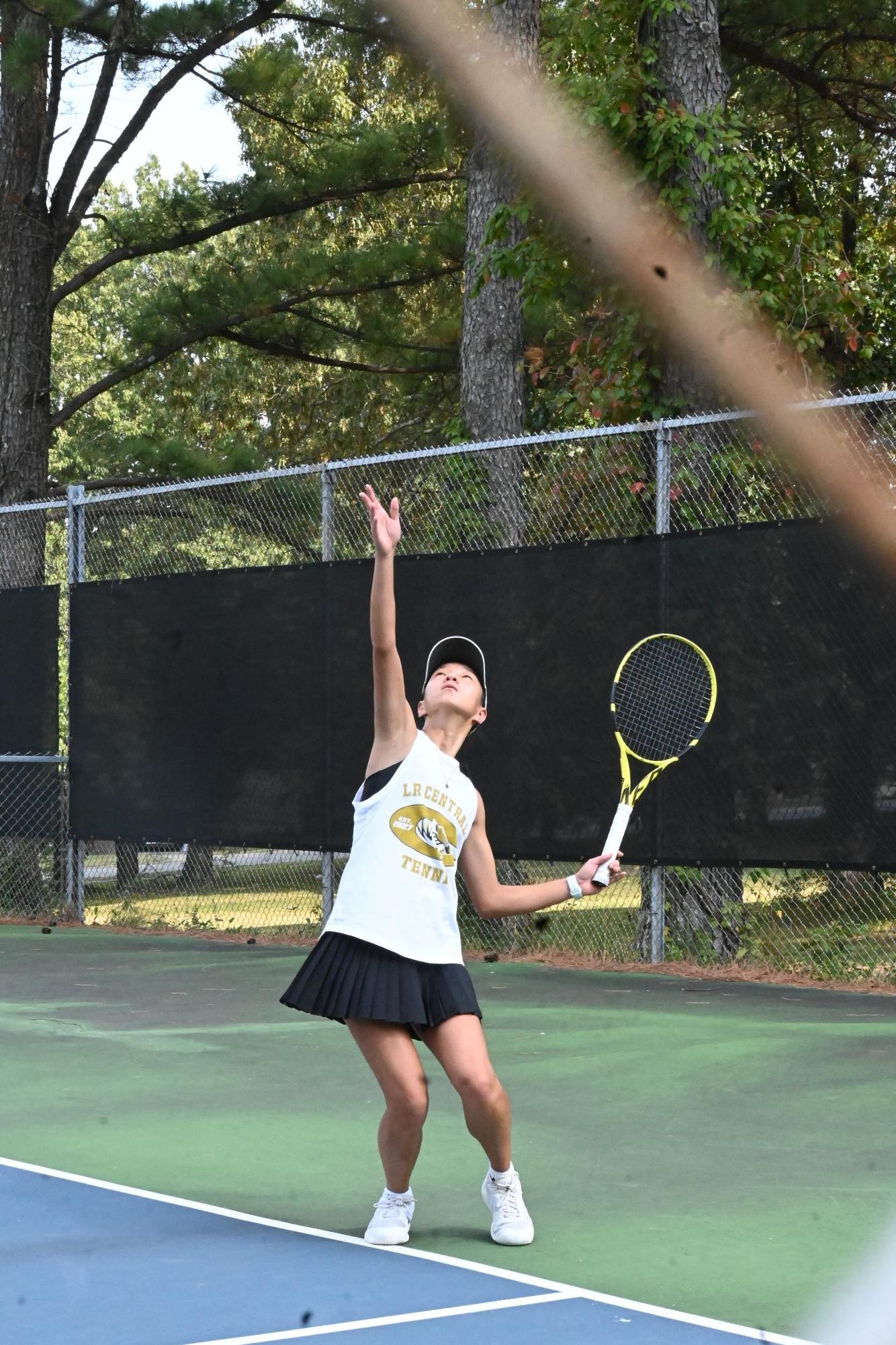 Junior Caroline Goldshall serves against Mount St. Mary.