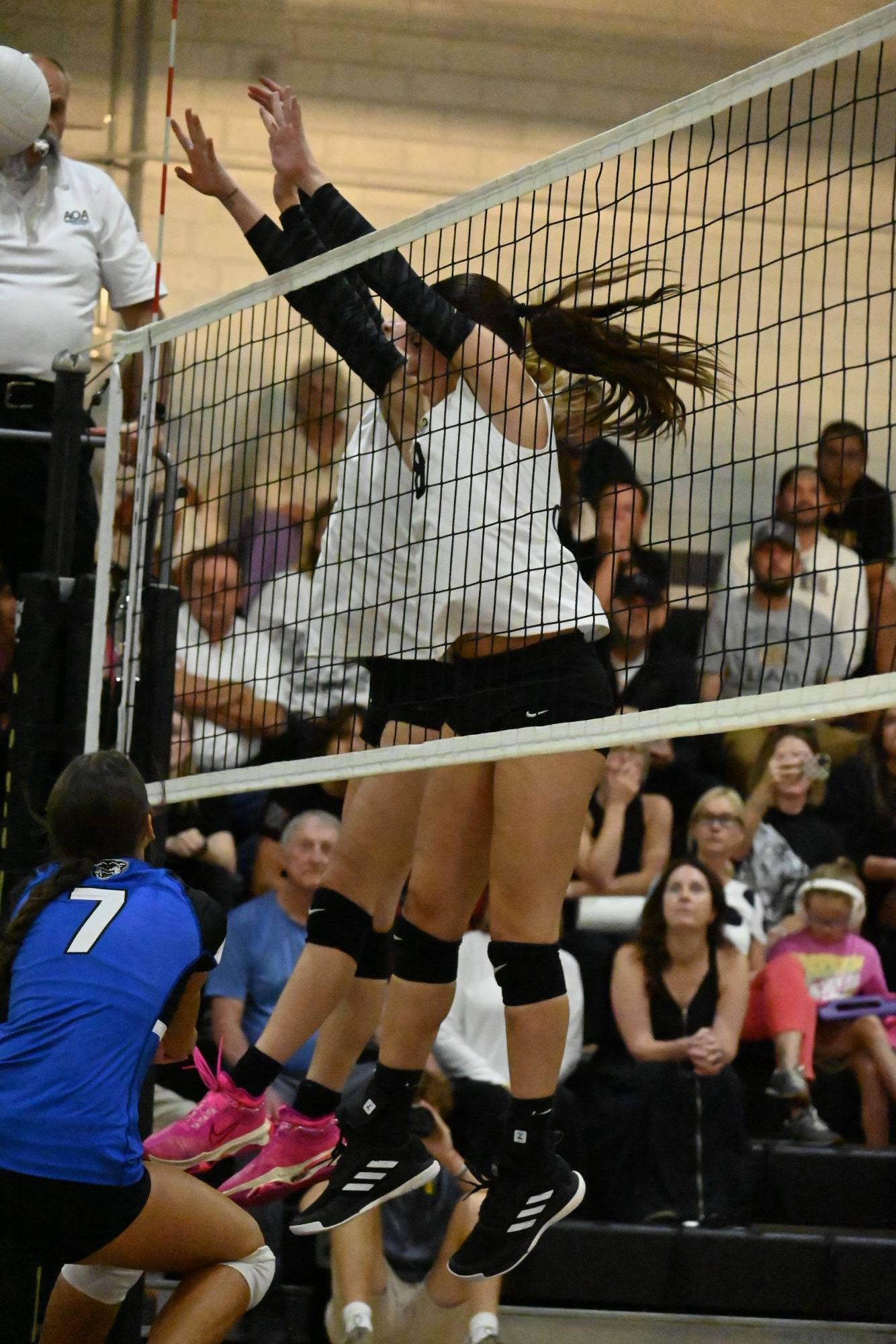 Senior Eliza Semans blocks a spike from Conway during a home game. Photo by Julianna Baldwin