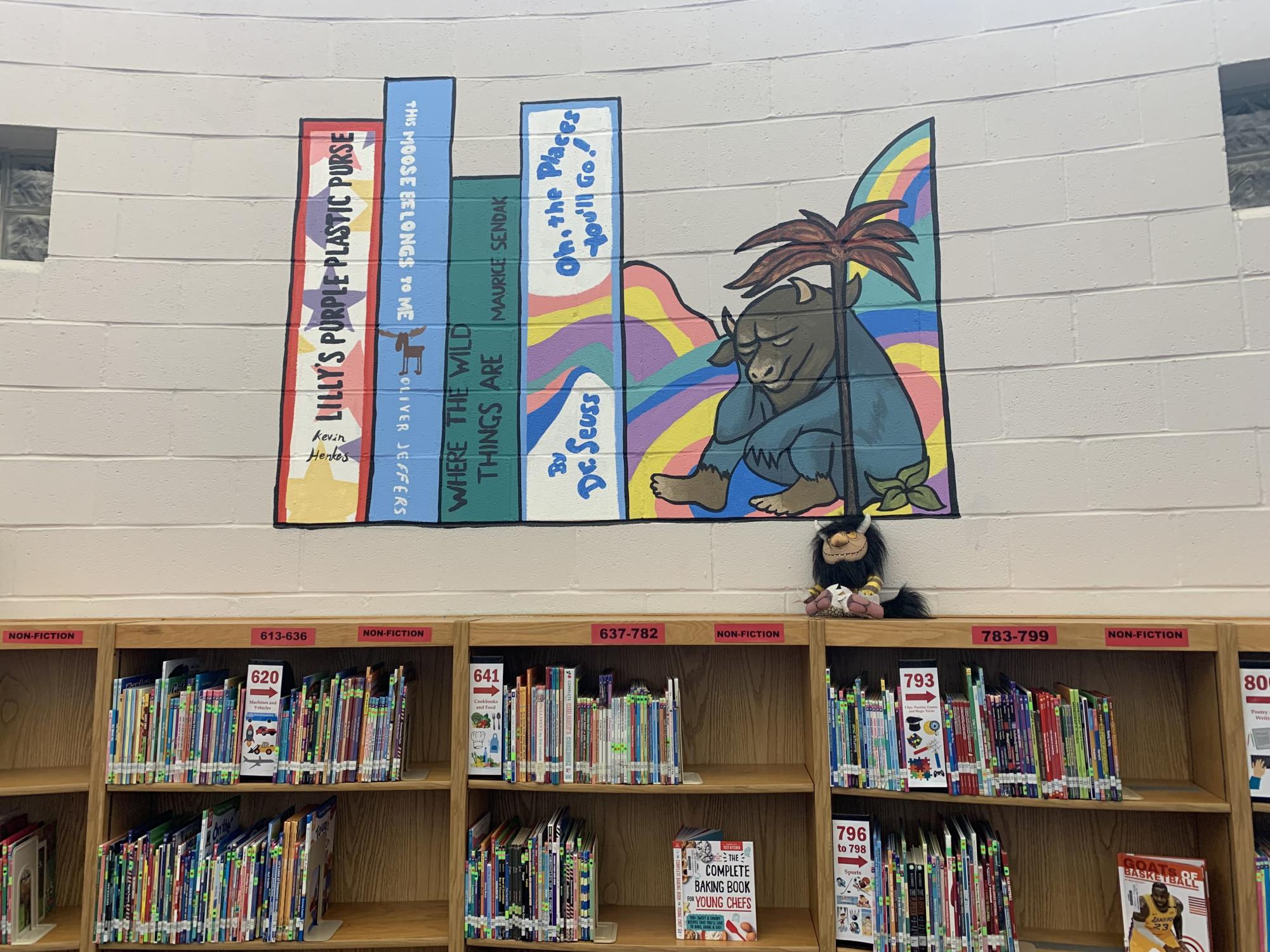 Several murals were painted by the Young Artists Association in the MLK Elementary library. Photo by Ava Kate White.