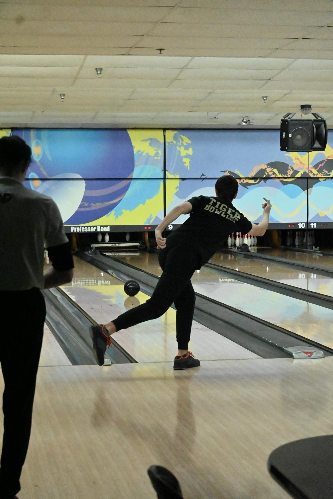 Brennan Horton rolls the ball down the lane. The boys' bowling team earned first place, with a total of 2342 points.