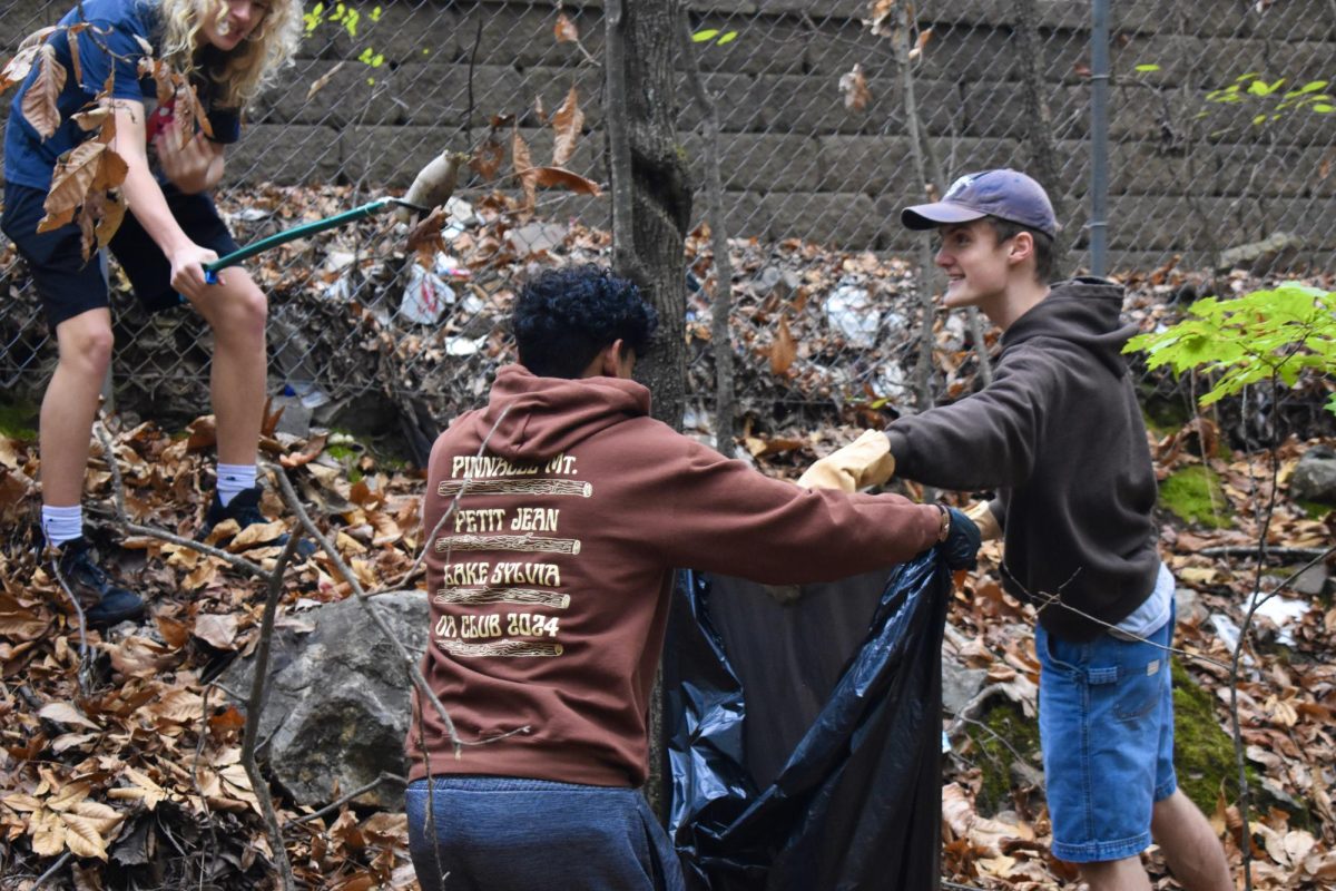 Juniors Aarush Gaddi and Miles Navin help to clean up Camp Aldersgate during the service event hosted by LRCHOA club.
