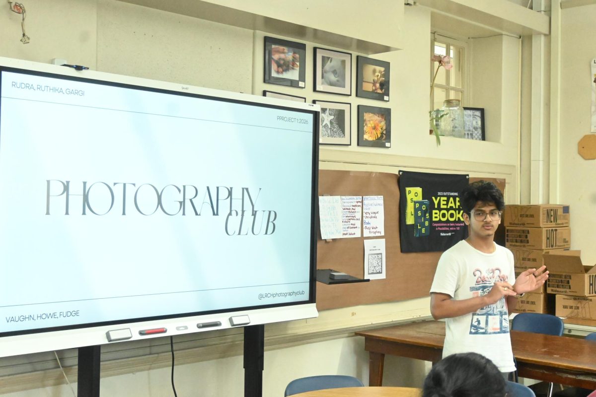 President and junior Rudra Patel gives introductory information during the photography club's first meeting in the yearbook room.