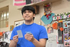 Sophomore Saúl Franco calls out cards in the Mexican BINGO game, La Lotería. "La bandera, la botella, el cazo," Franco said.