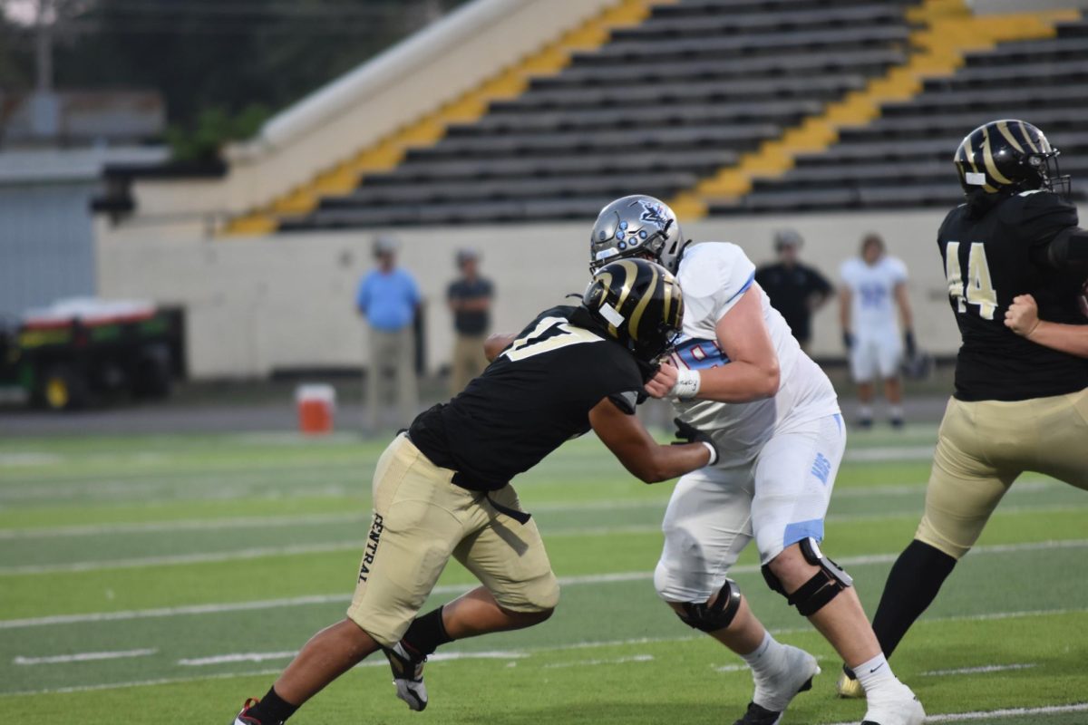 Defensive end Mycal Lindsey (senior) blocks a Fort Smith Southside linebacker at Quigley Stadium Sept. 12. The football team lost 7-35.