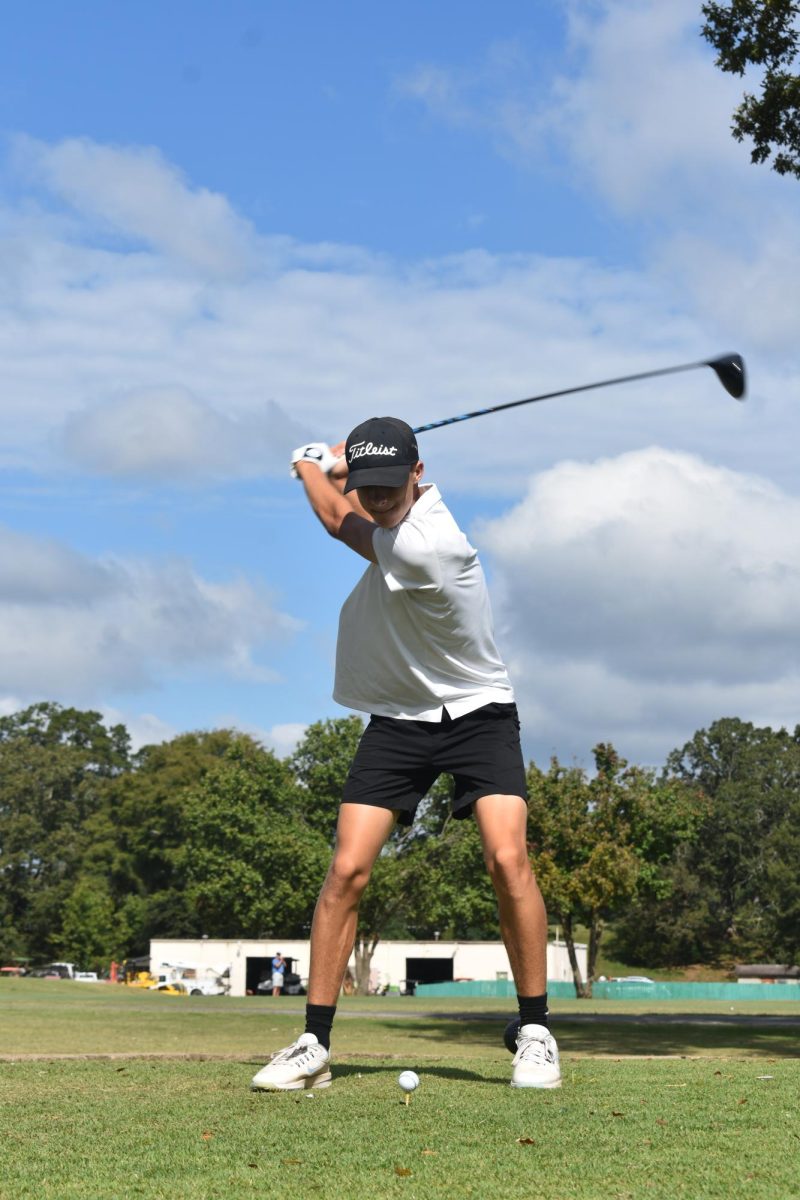 At the Catholic Invitational, sophomore Nathan Pfeifer, all-state finalist, hits a drive down the middle at Burns Park Golf Course Oct. 7. With a final score of 86 points, Pfeifer finished 44th out of 61.