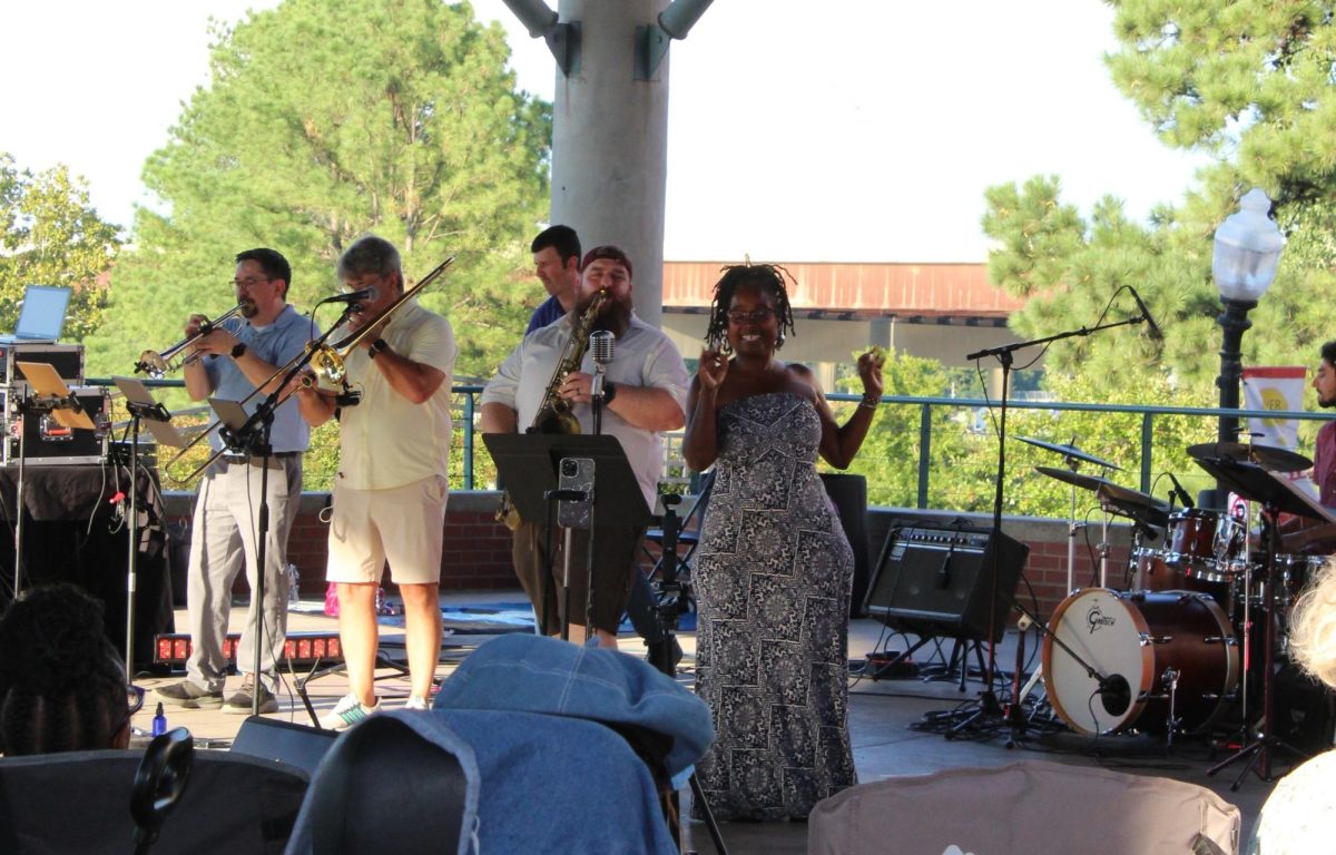 Performers Genine Latrice Perez and the Dizzy 7 Band, show-case their talents at the pavilions during their Sept. 3 set.