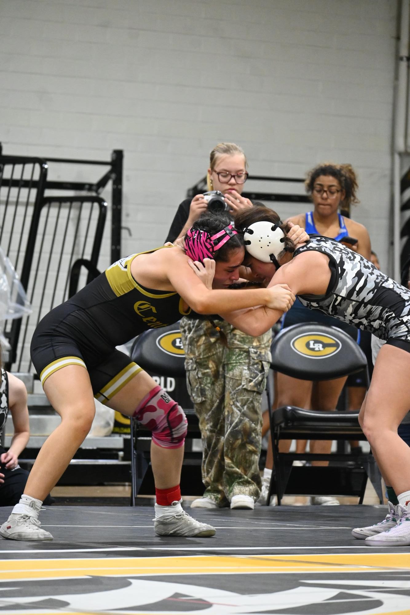Sophomore Maddox Quiroz-White ties up with her Bauxite opponent while setting up her next move during the Central Classic Dec. 5. 