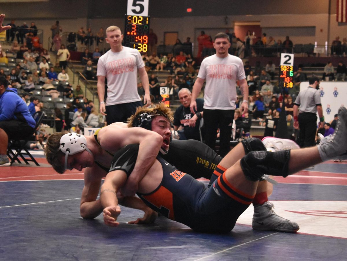 February 13, senior Will Palmer attempts to pin his opponent shoulders to win the match. Going into the state tournament, Palmer was undefeated with 22 wins. For the 138-lb. division, Palmer placed 3rd.