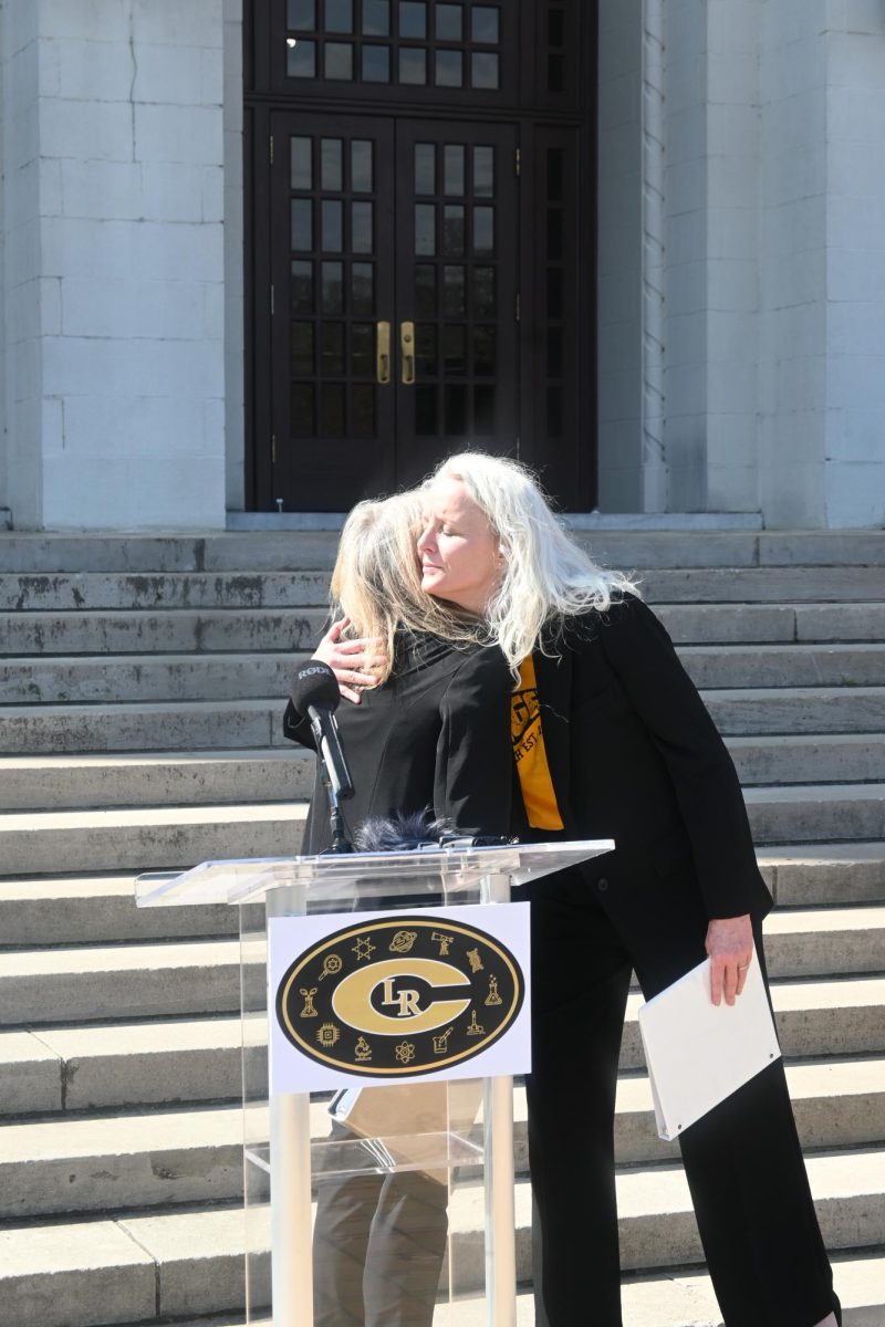 Principal Nancy Rousseau and April Rike embrace during the press conference March 6. Rike and Rousseau will work together this spring to ensure a smooth transition for students and faculty. Rike graduated in 1993, while Rousseau served as an assistant principal. "[She] will uphold the excellence and spirit of Central," said Rousseau.