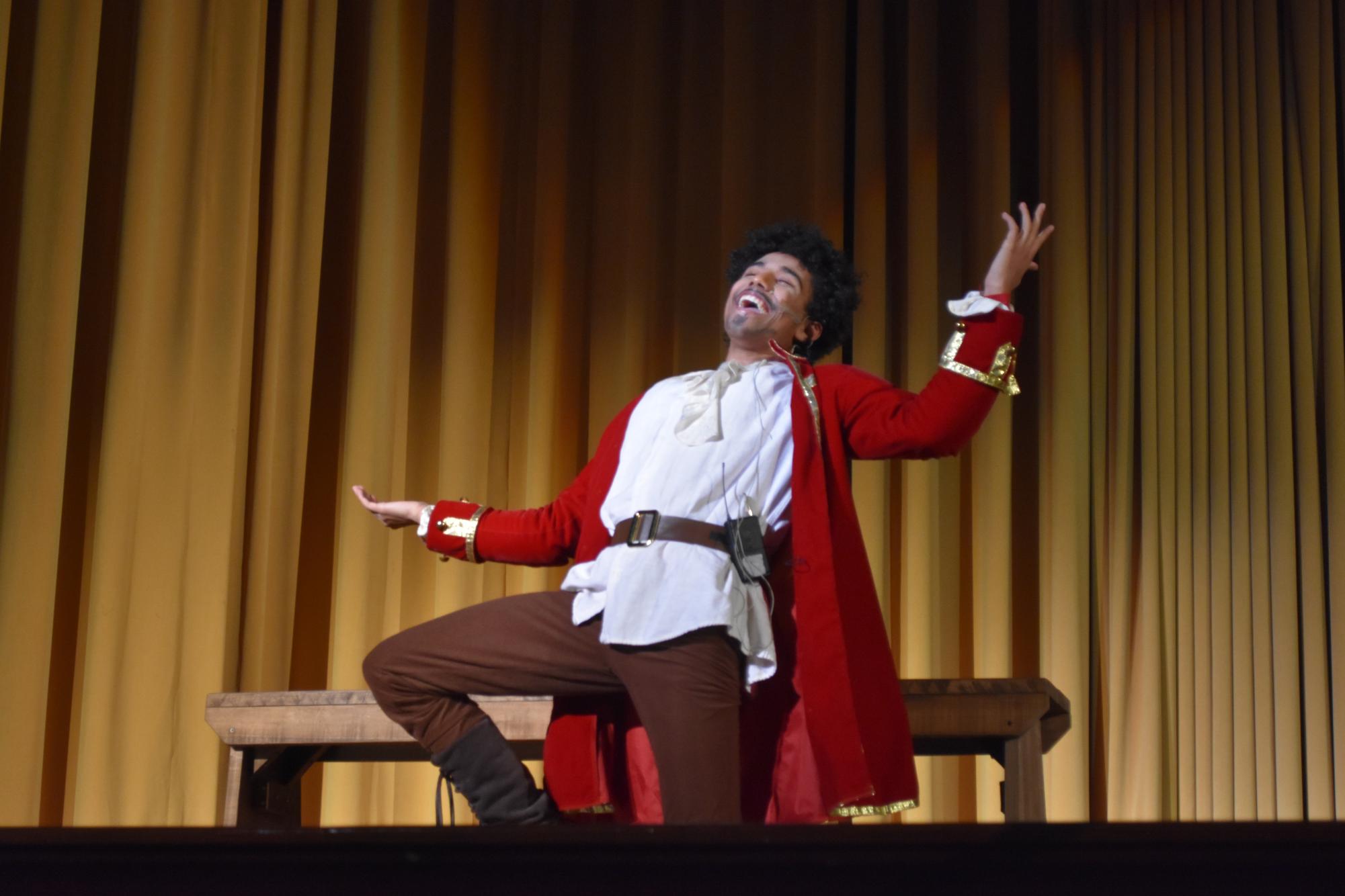 Junior Keegan Washington belts out a solo during his performance as Gaston in the 2023 fall musical, “Beauty and the Beast.”