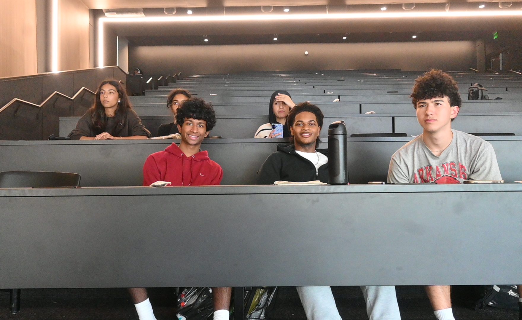 Seniors Sean Morello, Eliott Crowell, Keshav Ankem, Fajr Abdelayem, Maeher Kumar, and Junior Yashika Bhagat listen to a finance club presentation.