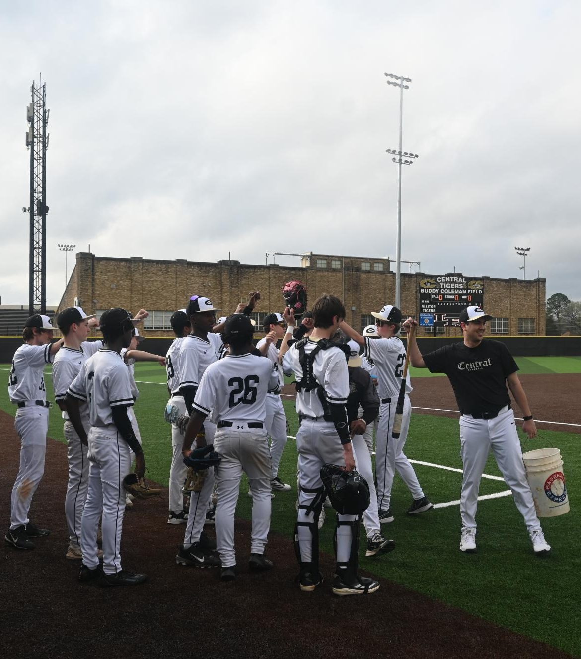 Baseball team does a pre-game huddle on March 9 against Watson Chapel. Varsity won 9-2.